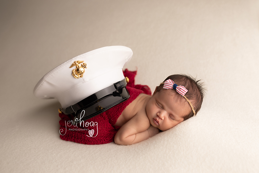 Newborn Adrienne Josie with Her Father's Marine Corps Hat