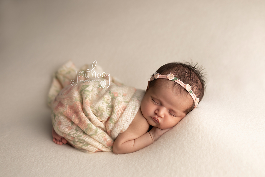 Newborn Girl Featured in Soft Colors